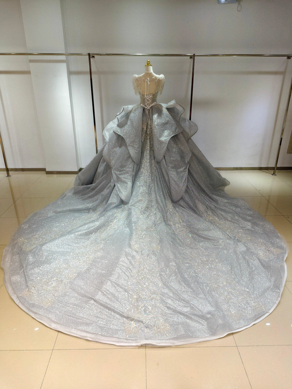 Silver Glimmer V-Neck Ballgown: Crystal-Embroidered Bust & Dramatic Bow Train