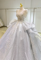 Silver Glimmer V-Neck Ballgown: Crystal-Embroidered Bust & Dramatic Bow Train