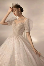 Sparkling Ball Gown Sweetheart Neck Tulle Wedding Dress with Beaded Embroidery & Sheer Puff Sleeves Q6021
